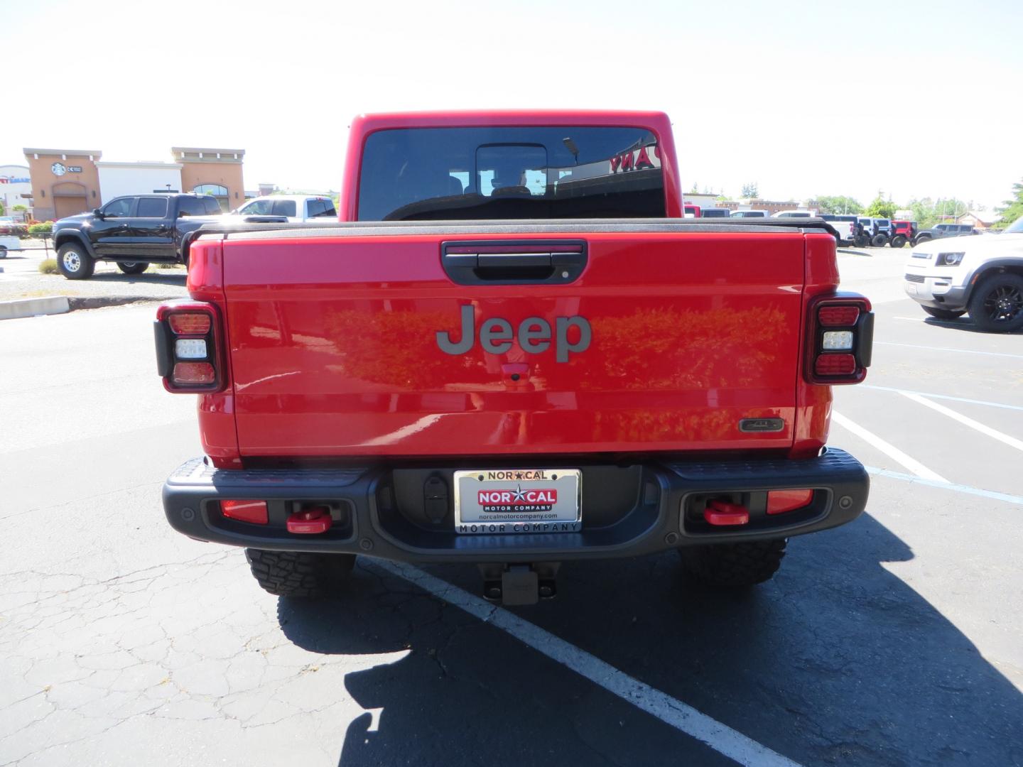 2020 Red /black Jeep Gladiator Rubicon (1C6JJTBG6LL) with an 3.6L V6 DOHC 24V engine, 6M transmission, located at 2630 Grass Valley Highway, Auburn, CA, 95603, (530) 508-5100, 38.937893, -121.095482 - Rubicon Gladiator featuring a Mopar suspension system with Fox shocks, 17" AEV wheels wrapped in 37" BFG tires, Warn Winch, Rock sliders, Cascade front license plate holder, Impact bedliner, Built Right Industries bed Molle panels, and Window tint. - Photo#5